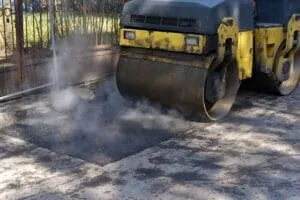 Fresh single-layer asphalt paving on a smooth road surface